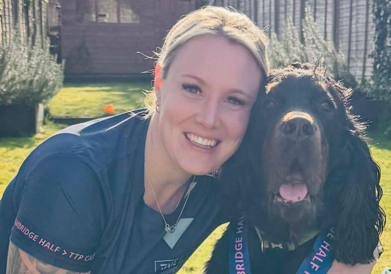Child protection officer, Charlie, pictured with her dog, is training for the London Marathon.
